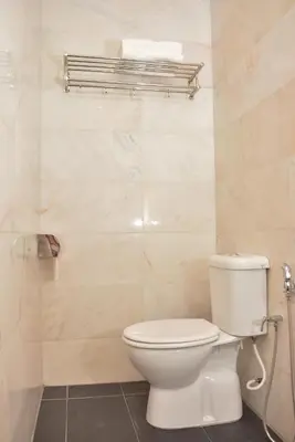 a bathroom with a toilet and a shower at DUTA HOTEL in Kuala Lumpur