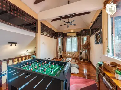 a living room with a pool table at 6BR San He Yuan RIAD Private Pool Villa KLCC View by Verano in Kuala Lumpur
