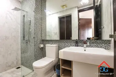 a bathroom with a toilet and a sink and a shower at The Elements by Grabstay in Kuala Lumpur
