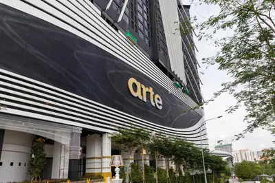 a large building with the cairns logo on it at Arte Mont Kiara Homestay in Kuala Lumpur