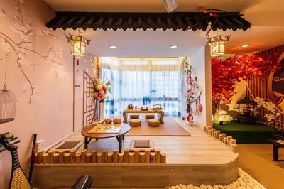 a living room with a table and a couch at Fahrenheit88 - China Theme Kuala Lumpur Bukit Bintang in Kuala Lumpur