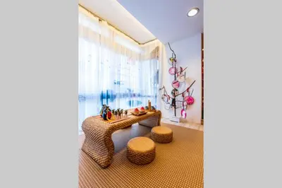 a room with a table and two stools and a window at Fahrenheit88 - China Theme Kuala Lumpur Bukit Bintang in Kuala Lumpur