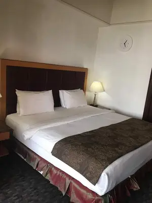 a large bed in a hotel room at Fantazya Suites Times Square in Kuala Lumpur