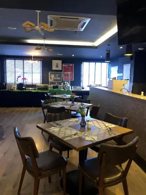 a dining room with tables and chairs in a restaurant at Alamis City Kuala Lumpur - Formerly EDC Hotel Kuala Lumpur in Kuala Lumpur