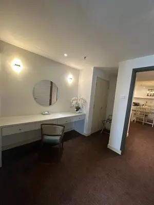 a room with a desk with a mirror and a chair at Alamis City Kuala Lumpur - Formerly EDC Hotel Kuala Lumpur in Kuala Lumpur