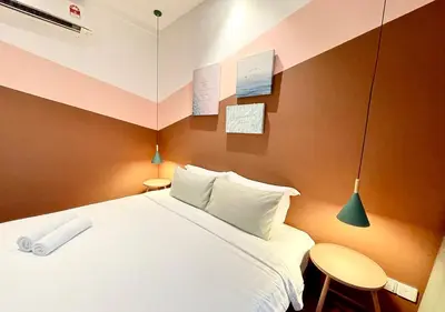 a bedroom with a large bed in a room at KL Gateway Premium Residences by Moka in Kuala Lumpur