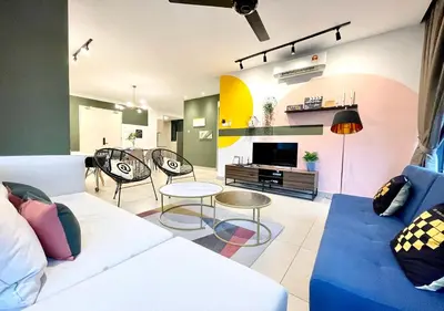 a living room with a couch and chairs and a tv at KL Gateway Premium Residences by Moka in Kuala Lumpur