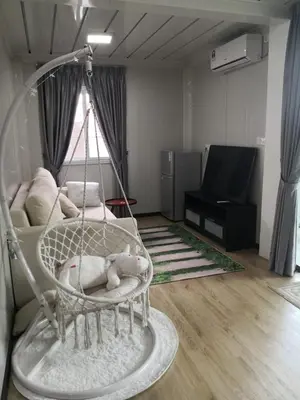 a room with a swing in a living room at Titiwangsa Cabin Retreats by Vale Pine in Kuala Lumpur