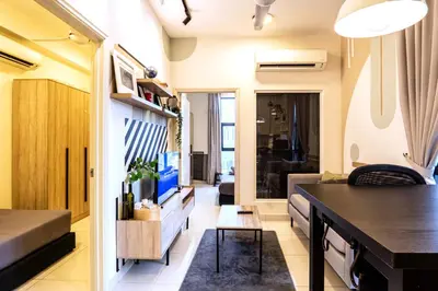 a living room and dining room of a tiny house at Arte Mont Kiara by Airhost in Kuala Lumpur