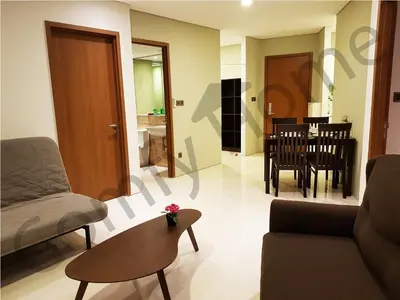 a living room with a couch and a table at KLCC Service suites by Home Sweet Home in Kuala Lumpur