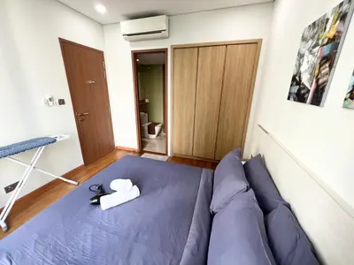 a room with a bed with a pair of scissors on it at Sky Suites KLCC by GENESIS in Kuala Lumpur