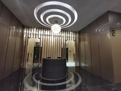 a hallway with a chandelier in a building at Sky Suites KLCC by Autumn Suites Premium Stay in Kuala Lumpur