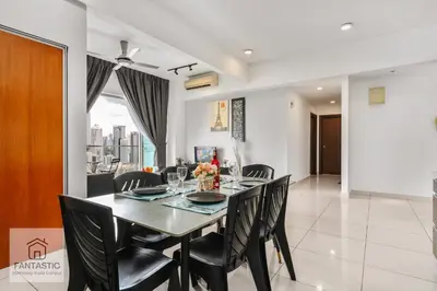 a dining room with a table and chairs at Regalia Residence @ KLCC View Sky Pool by KC in Kuala Lumpur