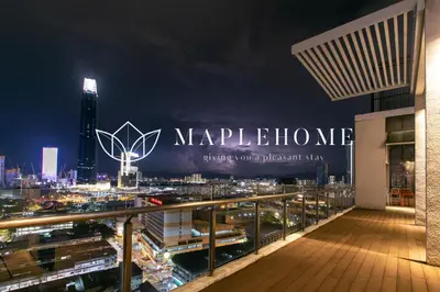 a view of a city at night with a large sign at D'Majestic Premier Suites Kuala Lumpur in Kuala Lumpur