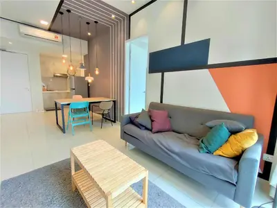 a living room with a couch and a table at Infini Suites@ The Robertson Bukit Bintang in Kuala Lumpur