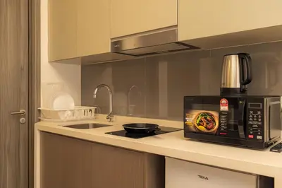 a kitchen with a microwave on a counter at Agile Delima Residence Bukit Bintang in Kuala Lumpur
