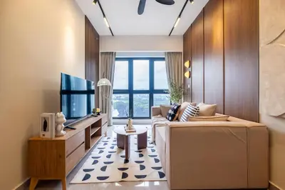 a living room with a couch and a tv at Agile Delima Residence Bukit Bintang in Kuala Lumpur