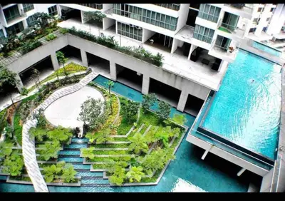 an aerial view of a building with a swimming pool at Cozy Regalia KL 吉隆玻 LRT & KTM @1 Parking & WIFI in Kuala Lumpur