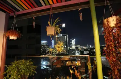 a view of a city at night from a balcony at Orkid Hills Hotel at Bukit Bintang in Kuala Lumpur