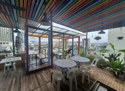 a restaurant with tables and chairs and a colorful ceiling at Orkid Hills Hotel at Bukit Bintang in Kuala Lumpur