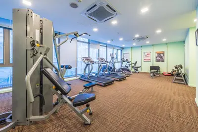a gym with treadmills and elliptical machines at FAIRLANE 2mins walk to Bukit Bintang BEST SUNSET view 2BR 8-1 WIFI 100mbps in Kuala Lumpur