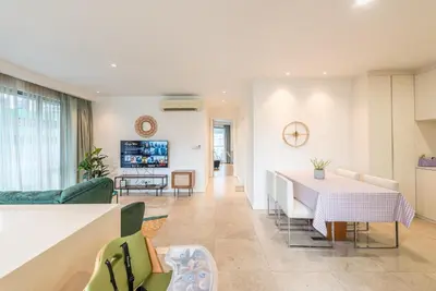 a kitchen and living room with a table and chairs at FAIRLANE 2mins walk to Bukit Bintang BEST SUNSET view 2BR 8-1 WIFI 100mbps in Kuala Lumpur