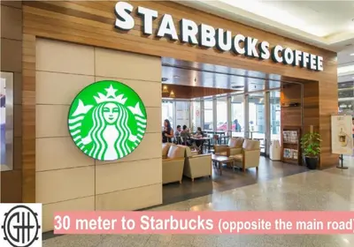 a starbucks coffee store with a starbucks logo on the wall at GH KLCC Apartment by GuestHouse in Kuala Lumpur
