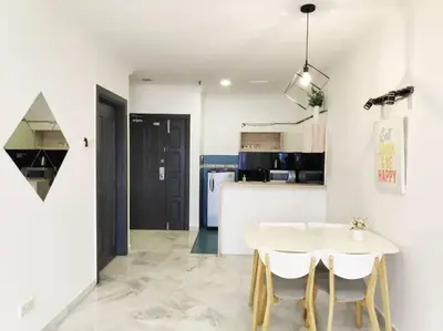 a kitchen and dining room with a white table and chairs at Eco One Bedroom Apartment @ Jalan Ampang, 3 pax in Kuala Lumpur