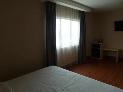 a bedroom with a white bed and a window at Metro Hotel @ KL Sentral in Kuala Lumpur