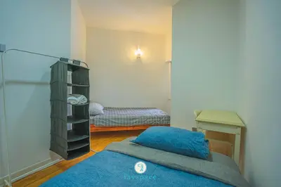 a small room with two beds and a room with two beds at Doorstep - Sunway Putra Mall - Close to PWTC for 4 in Kuala Lumpur