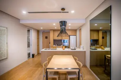 a dining room and kitchen with a table and chairs at 188 Suites with Washer and Bathtub near KLCC Kula Lumpur in Kuala Lumpur