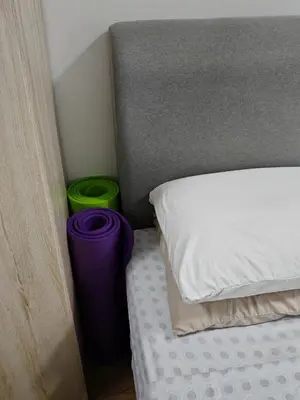 a bedroom with a bed and two green buckets at ASTORIA AMPANG, 6Pax - Near KLCC, ZooNegara, AmpangPoint Mall in Kuala Lumpur
