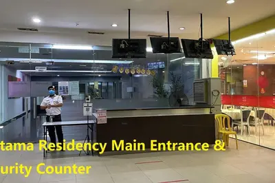 a man standing in front of a counter in a restaurant at Private Jacuzzi Staycation at KL City 152 in Kuala Lumpur