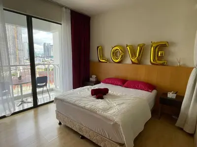 a bedroom with a bed with a teddy bear on it at Private Jacuzzi Staycation at KL City 921 in Kuala Lumpur
