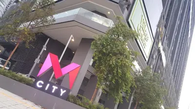 a building with a x city sign on it at MCity Jalan Ampang KLCC in Kuala Lumpur