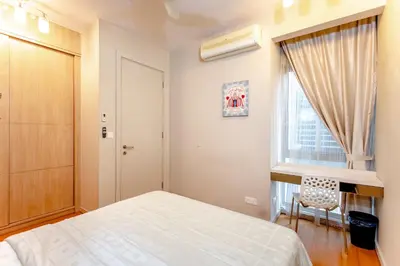 a bedroom with a white bed and a window at Rex Ollie @ Myhabitat Condominium in Kuala Lumpur