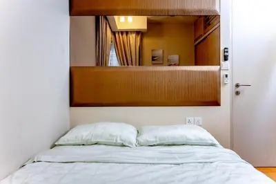 a bedroom with a bed with a mirror above it at Rex Ollie @ Myhabitat Condominium in Kuala Lumpur