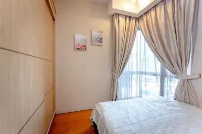 a bedroom with a bed and a large window at Rex Ollie @ Myhabitat Condominium in Kuala Lumpur