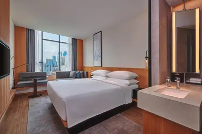 a hotel room with a bed and a sink at Fairfield by Marriott Chow Kit Kuala Lumpur in Kuala Lumpur