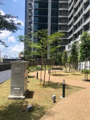 a box in a park with trees and a building at Legasi Kampung Baru apartment by Rumahrehat twin tower view in Kuala Lumpur