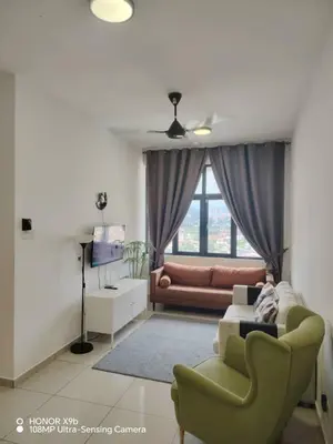 a living room with a couch and a chair at Legasi Kampung Baru apartment by Rumahrehat twin tower view in Kuala Lumpur