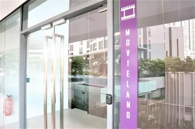 an entrance to a building with a purple sign on the door at MyCribKL The Robertson 2 Bedroom Bukit Bintang in Kuala Lumpur