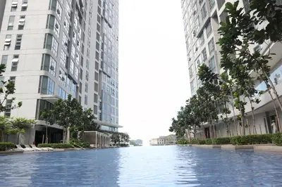 an empty street in a city with tall buildings at MyCribKL The Robertson 2 Bedroom Bukit Bintang in Kuala Lumpur