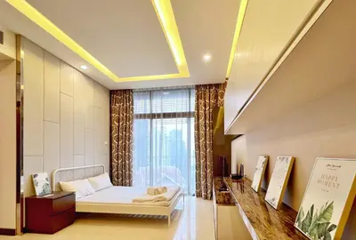 a living room with a couch and a window at Nana's at Dorsett Residence Bukit Bintang in Kuala Lumpur