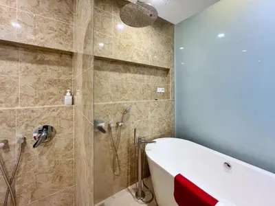 a bathroom with a bath tub and a shower at Nana's at Dorsett Residence Bukit Bintang in Kuala Lumpur