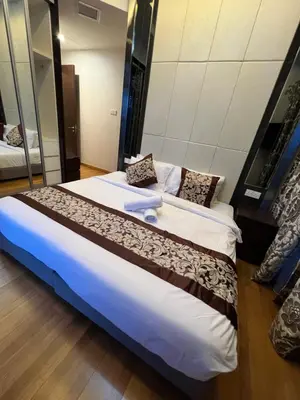 a bedroom with a large bed in a room at Dorsett Residence Service Suite At Bukit Bintang KL in Kuala Lumpur