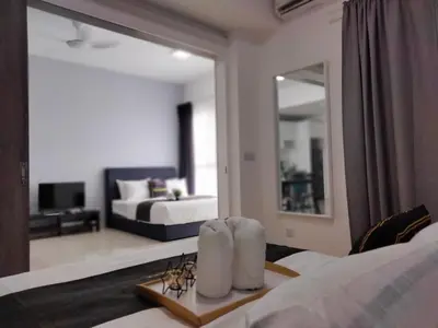 a hotel room with a bed and a mirror at Continew Residence by HomeBrickz in Kuala Lumpur