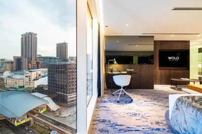 a room with a view of a city at WOLO Kuala Lumpur in Kuala Lumpur