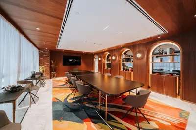 a dining room with a long table and chairs at WOLO Kuala Lumpur in Kuala Lumpur