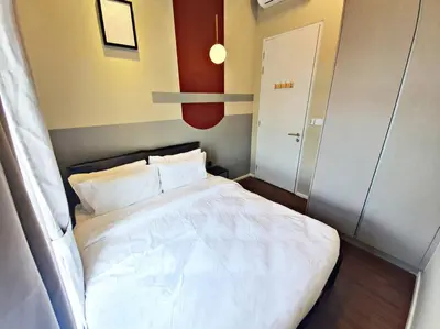 a small bedroom with a white bed in it at ※THE UNIQUE HOME @ KL※ SUNWAY VELOCITY-TRX ◆2-7PAX in Kuala Lumpur